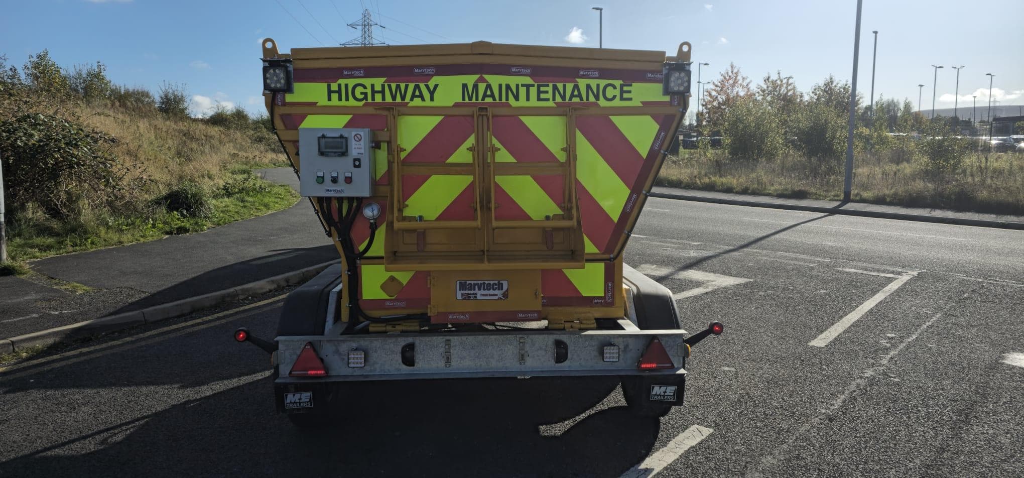 Rear of the Hotbox showing Highway Maintenance chevrons, work lights and burner controls